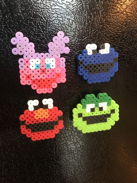 Abby, Cookie Monster, Elmo and Oscar perler bead magnets Alpha Patterns Perler Beads, Tiny Perler Bead Patterns Food, Elmo Perler Beads, Fuse Bead Patterns Small And Easy, Perler Bead Magnets, Melt Beads Patterns, Easy Perler Bead Patterns, Pearl Beads Pattern, Easy Perler Beads Ideas