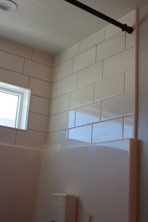 Subway tile above shower surround Makeover Kamar Mandi, Tile Tub Surround, Bathtub Surround, Shower Inserts, Modern Bathroom Remodel, Fiberglass Shower, Bathtub Remodel, Bathroom Remodel Tile, Tub Surround