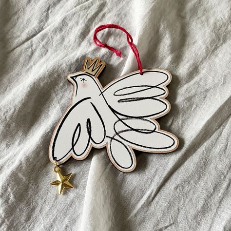 Beautiful Christmas Peace Dove decoration, perfect for displaying in your festive home! These Doves are printed on responsibly sourced Cherry veneer, sustainably made in the UK - they're then hand finished by myself with a shining gold star and cotton cord.  Numbers are very limited!  This listing is for one decoration.  - Details - - Decorations measure 3" across - Responsibly sourced materials - Hand finished  Always plastic free packaging One Decoration, Christmas Peace, Peace Bird, Dove Ornaments, Decoration Details, Ply Wood, Metal Star, Golden Crown, Peace Dove