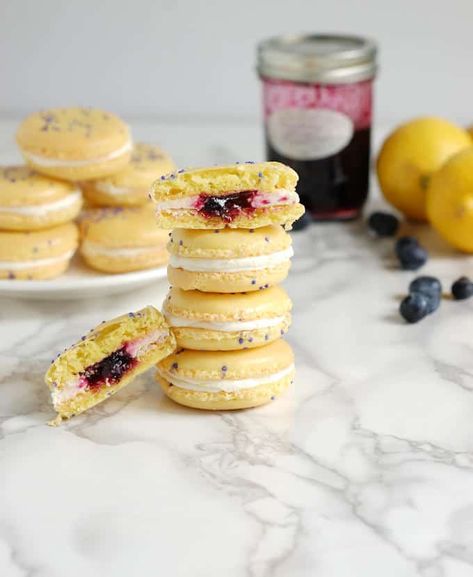 French Macarons flavored with lemon and filled with lemon buttercream and blueberry lemon preserves. Watch a step by step video how to make macarons. #how to make #video #best #authentic #french #best Macaroon Ideas, Lemon Preserves, French Macarons Flavors, Blueberry Macarons, French Macaroon Recipes, Lemon And Blueberry, Kue Macaroon, Macaron Filling, Macaroon Cookies