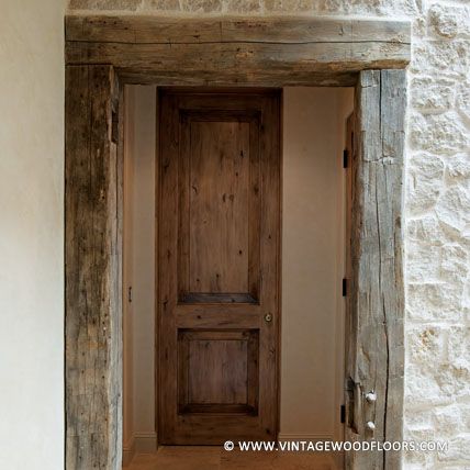 Not every #reclaimedwood beam ends up a beam in a new project. This doorway is finished with antique hand hewn beams giving it a truly unique and old world look. | vintagewoodfloors.com Old Wooden Beams Ideas, Beam Ideas, Lodge Style Home, Barn Wood Wall, Reclaimed Wood Flooring, Reclaimed Wood Door, Wide Plank Floors, Home Office Layouts, Cottage Woods