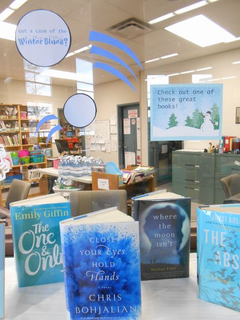 Winter Blues Library Display with free downloadable signs School Library Book Displays, Blue Library, Winter Display, Christmas Bulletin Boards, January Books, Teen Library, Middle School Libraries, Library Themes, Winter Bulletin Boards