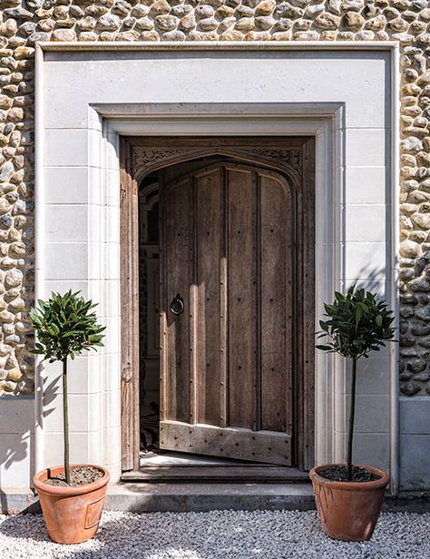 The front door is framed by a limestone surround reclaimed from a ruined 15th-century monastery Limestone Door Surround, Front Door Casing, Stone Door Frame, Stone Door Surround, Front Door Surround, Exterior Door Frame, Front Door Canopy, Stone Exterior Houses, Antique Brick