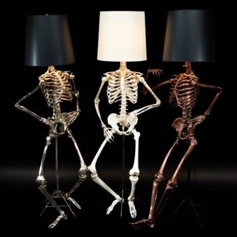 Ever wanted a life-sized skeleton lamp with a lampshade for its head? Then have I got the lamp for you! Zia Priven makes these posable skeleton lamps called the “Philippe.”   The skeleton happily sits on a stand so you can easily reposition it in any pose you want. (Mine would be flipping everyone the bird.) The “human” bones come in silver, bronze or an off-white and is topped with a black or white lampshade.   There is no price listed on the Zia Priven website. I’d imagine these cost a p... Unusual Floor Lamps, Skeleton Lamp, Life Size Skeleton, Goth Home, Cool Lamps, White Lamp Shade, Skull Decor, Gothic Decor, Gothic Home Decor