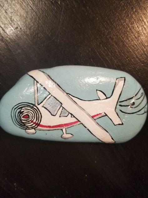 Airplane rock. Airplane Painted Rocks, Airplane Painting, Airplane Theme, Children Activities, Stone Art Painting, Hand Prints, Travel Painting, Halloween Crafts Decorations, Kid Friendly Travel Destinations