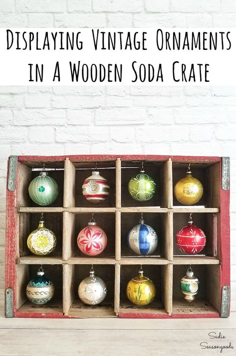 Upcycling a bottle crate or vintage soda crate is a SUPER EASY way to display your Shiny Brite ornaments or vintage Christmas ornaments. And you can even store them in the crate for the rest of the year - BONUS! Get all the repurposing details at www.sadieseasongoods.com . #vintagechristmas #vintagechristmasdecorations #vintagedecor #woodencrates #shinybrite #vintagechristmasornaments #xmasdecorations #xmasornaments #xmasdecor #christmasdecorationideas #antiquechristmas #christmascraftsdiy Christmas Ornament Display, Pretty Christmas Ornaments, Retro Christmas Decorations, Vintage Soda, Ornament Stand, Rustic Christmas Ornaments, Vintage Crate, Shiny Brite Ornaments, Ornament Display