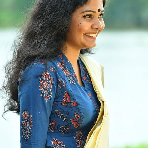 Rumour has it that peplums originated in Ancient Greece as a way of injecting style into their voluminous robes. Here's our take on it, the Peplum Blouse! https://www.seamstress.co.in/collections/blouses Band Neck Blouse Design, Indigo Blouse, Bride Kerala, Kannada Bride, Telugu Bride, Tamil Bride, Blouse Pictures, Saree Jackets, Patchwork Blouse