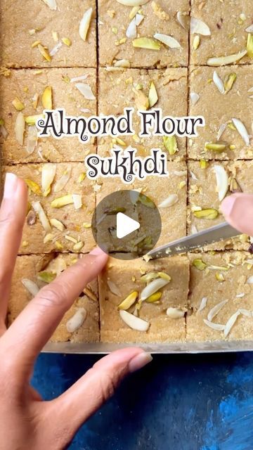 Nidhi Parmar on Instagram: "Almond Flour Sukhdi Recipe | Gol papdi | Gur Papdi : Sukhdi, also called Gur papdi or Gol papdi, is a classic Indian sweet hailing from Gujarat in western India. It’s a delightful treat crafted from simple ingredients like wheat flour, ghee (clarified butter), and jaggery (unrefined sugar). To make it even healthier and gluten-free, I’ve substituted almond flour for wheat flour. Here’s more about almond sukhdi Ingredients: * 2 cups almond flour * 1 cup ghee * 1 cup jaggery * 1 tsp cardamom powder * Dry fruits for garnish Instructions: * Heat a pan and add 1 cup of ghee to it.  * Once the ghee melts, add 2 cups of almond flour.  * Roast the almond flour in ghee until it turns a golden brown color, stirring continuously to prevent burning. This should take a few Sukhdi Recipe, Easy Indian Dessert Recipes, Easy Indian Dessert, Desi Recipes, Golden Brown Color, Gujarati Food, Sweet Dishes Recipes, Almond Flour Recipes, Indian Dessert Recipes