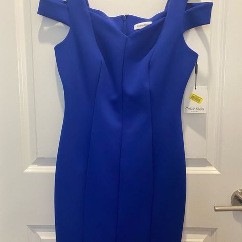 Never Been Worn. Calvin Klein Blue Dress. Size 8. Has Cutouts On The Sleeve And A V-Neckline. Tight-Fitted Dress. I Would Say Runs Small. Free People Adella Dress, White Knit Sweater Dress, Women Calvin Klein, Calvin Klein Blue Dress, Orange Bodycon Dress, Mustard Yellow Dresses, Tight Fitted Dresses, Boden Women, Sundress Dress