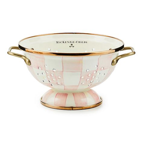 For kitchen preparations with personality, look no further than the Small Rosy Check Enamel Colander. The steel underbody makes this number a workhorse, and the hand-painted, color-dragged checks in a range of rosy hues and antiqued brass-finish handles give some pizzazz to scrubbing potatoes and sass to straining salads. | Rosy Check Small Colander Pink Kitchen Supplies, Splatter Screens, Enamel Cookware, Kitchen Strainer, How To Use Dishwasher, Up House, Pink Kitchen, Cute Kitchen, Mackenzie Childs