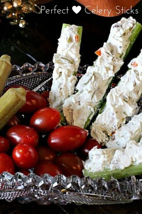 Perfect stuffed celery appetizer recipe. Celery is the perfect vessel for a mixture of cream cheese and chopped green pimento-stuffed olives. Throw in some crunchy walnuts and some blue cheese and you've got an appetizer full of memories. via @lannisam Stuffed Celery Sticks, Stuffed Celery, Holiday Buffet, Celery Recipes, Cream Cheese Appetizer, Celery Sticks, Popular Appetizers, Catering Display, Appetizers Recipes