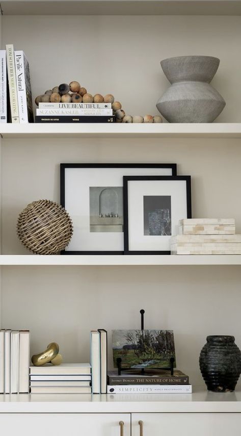 Simple Shelves Decor, Book Shelf Decor Living Room Modern, Minimal Floating Shelf Decor, Contemporary Living Room Shelves, Office Shelving Styling, Gallery Above Console Table, Simplistic Shelf Decor, White Shelves Styling, Three Shelf Decor