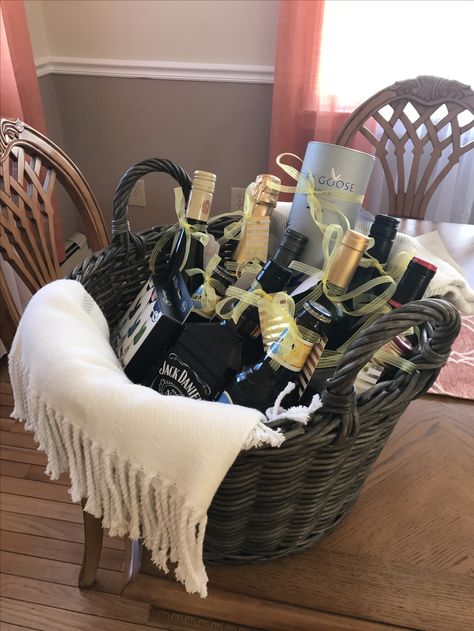 Fun wine/alcohol basket for a year of firsts for the newly wed! 🤗 #bridalshower #wedding #mrandmrs Booze Basket Ideas, A Year Of Firsts Wine Basket, Bridal Shower Wine Gift Basket, Raffle Baskets With Wine And Glasses, Wine Basket First Year Of Marriage, Bridal Shower Wine Gift Basket Tags, Alcohol Basket, Wine Alcohol, Newly Wed