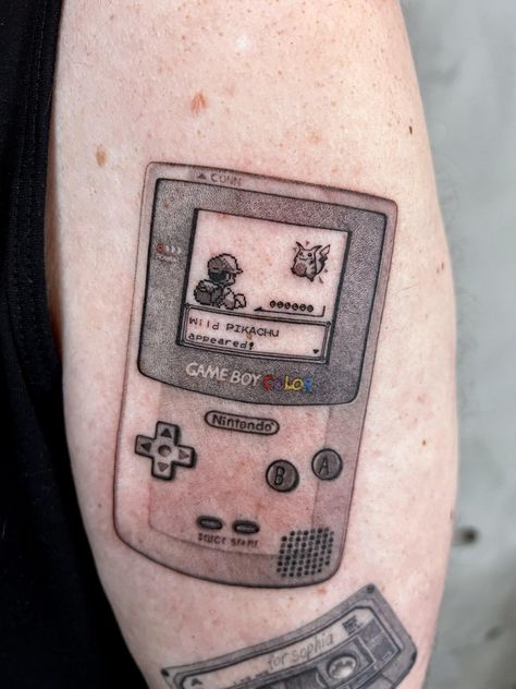 Gameboy Color Tattoo, Aris Tattoos, Nintendo Tattoo Ideas, Gameboy Tattoo, Video Game Tattoo Ideas, Pikachu Tattoo Design, Game Tattoo Ideas, Nintendo Tattoo, Game Tattoo