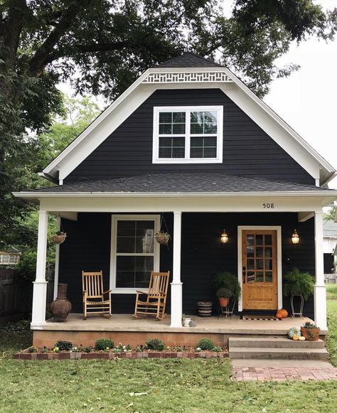 Small Charcoal House Exterior, Navy Cabin Exterior, Dark Exterior Cottage, Black House Wooden Shutters, Black And White Tiny Home Exterior, Small House Black Exterior, Black Siding Exterior Small House, Dark Blue Cottage Exterior, Dark Siding House Exterior Colors Small House