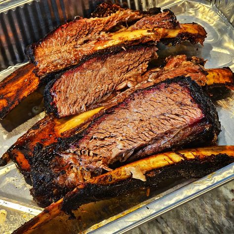 Smoked Dino Ribs (aka beef ribs) are considered by many to be the greatest bite in BBQ. Seasoned with our new Open Fire Smokey Road Rub and then slowly smoked over hickory wood, this meat will be fall off the bone tender. Visually appealing and mouthwateringly delicious, this BBQ all-star is surprisingly easy to pull off. Follow this recipe and any BBQ beginner will be able to impress the toughest critics. Hickory Wood, Open Fire, Beef Ribs, Open Fires, A Dinosaur, The Bone, All Star, Let Me, Meat