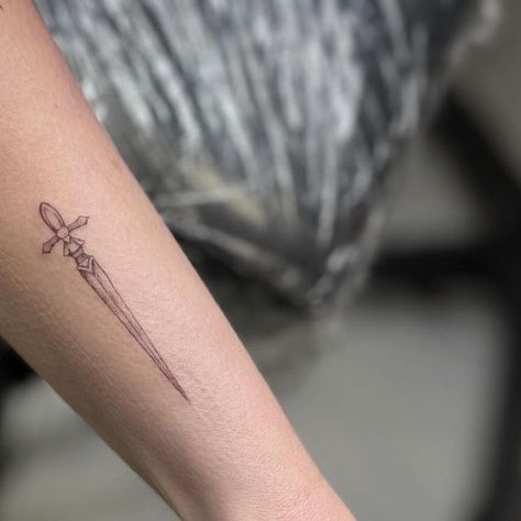 Love Spell Tattoo on Instagram: "Delicate and precise dagger tattoo by our very talented resident artist @emily_tattoos ✨  #finelinetattoo #blackandgraytattoo #daggertattoo #microtattoo #wristtattoo #littlerock #arkansas" Dagger Tattoo Forearm, Dagger Tattoo Feminine, Simple Dagger Tattoo, Spell Tattoo, Dagger Tattoo, Love Spell, Fine Line Tattoos, Forearm Tattoos, Love Spells