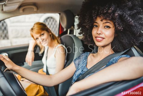 Stock Image: Two young women friends driving in the city - Millennials use the car to get around - People look towards the camera Two People In A Car Reference, People In Car Drawing Reference, Driving Car Pose Reference, Person In Car Reference, Reference Pose 2 People, Driving Car Reference Drawing, Driving Car Pose Reference Drawing, Driving Drawing References, Person Driving Car Reference