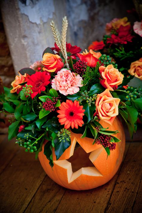 Our table flowers in pumpkins carved with hearts & stars. Flowers In Pumpkins, Pumpkin Arrangements, Halloween Floral, Halloween Flowers, Pumpkin Flower, Pumpkin Art, Deco Floral, Autumn Colors, Fall Holidays