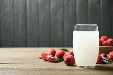 Lychee juice and fresh fruits on wooden table. Space for text #AD , #sponsored, #fresh, #fruits, #Lychee, #juice, #Space Lychee Juice, Juice Ad, Fresh Fruits, Wooden Table, Wooden Tables, Brochure Template, Fresh Fruit, Juice, Stock Photos