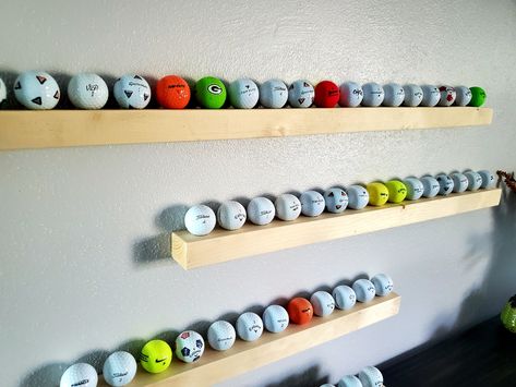 "Great way to display your collection of golf balls or even better gift for someone else! Each rack is made from reclaimed lumber that would have been thrown away before we rescued it. We cut each to size, drill out the holes, sand, finish and install easy to hang hardware. Each rack will come with wall anchors and screws to securely mount to any wall. Even better you will get a FREE golf ball with each rack ordered. (Golf balls may be new and or used)    We make four different sizes: 12\"- 6 Ba Golf Ball Holder Display, Golf Display, Golf Ball Display, Golf Ball Holder, Golf Ball Displays, Golf Room, Ball Display, Ball Holder, Golf Theme