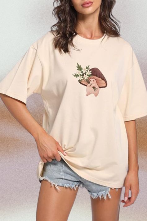 Kawaii Mushroom Print T Shirt, Short Sleeve, Crewnck, Casual, Loose Fit, Oversized Graphic Tee Kawaii, Mushroom Tee Shirt Women, Cute Shirts For Teen Girls Summer, Nature Lover Tee, Fungi Graphic T-Shirts, Mycology Shirts. A Must Have For Mushroom Lover Gift. It Is Super Flattering. #amazon #amazonffinds #amazonbestsellers #tee #top #shirt #hemmed #shortsleeve #roundneck #crewneck #graphicprint #oversized #loose #kawaii #mushroom #cottagecore #nature #flowers #beige Cute Mushroom, Oversized Graphic Tee, Teen Top, Shirts For Teens, Womens Tops Summer, Ladies Tee Shirts, Short Sleeve Tops, Home T Shirts, Oversized T Shirt