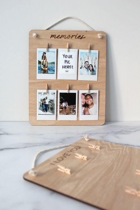 DETAILS Choose from "Memories" or "I Love You" heading Engraved Oak wood Natural Cotton Cord Clips for Photo Polaroid Pictures Not Included (+$5.00 to print your 6 photos) Email your photos to info@shopgafhome.com with your order # included. Only portrait oriented photos for best results. DIMENSIONS 8.5" x 10.5" Each item is made with natural Oak and may have slight differences from one to another. Each piece is unique! Gifts Made From Photos, Polaroid Photo Holder, Photo Holder Ideas, Wood Photo Frame Design, Sentimental Crafts, Picture Holder Wall, Picture Gift Ideas, Polaroid Holder, Diy Photo Holder