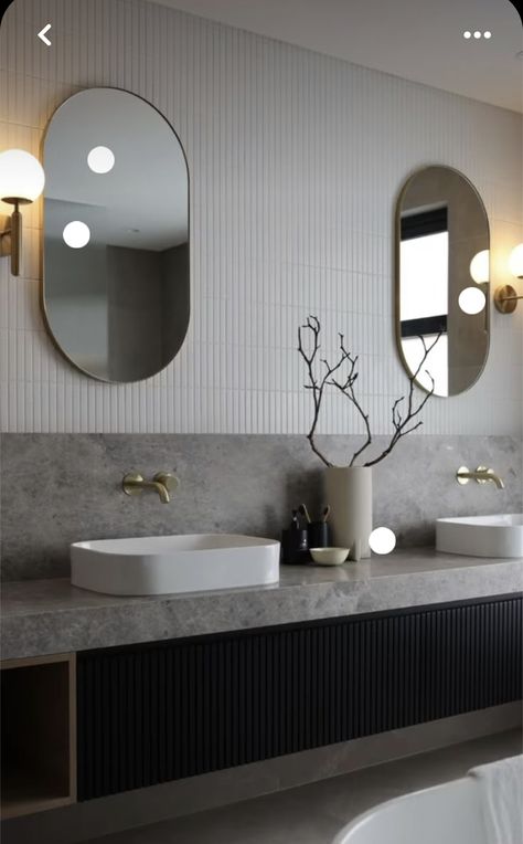 Modern Lux Bathroom, Hotel Lobby Bathroom, Dezeen Bathroom, Reeded Door, Oval Mirrors, Bathroom 2023, Stone Vanity, Restroom Design, Washroom Design