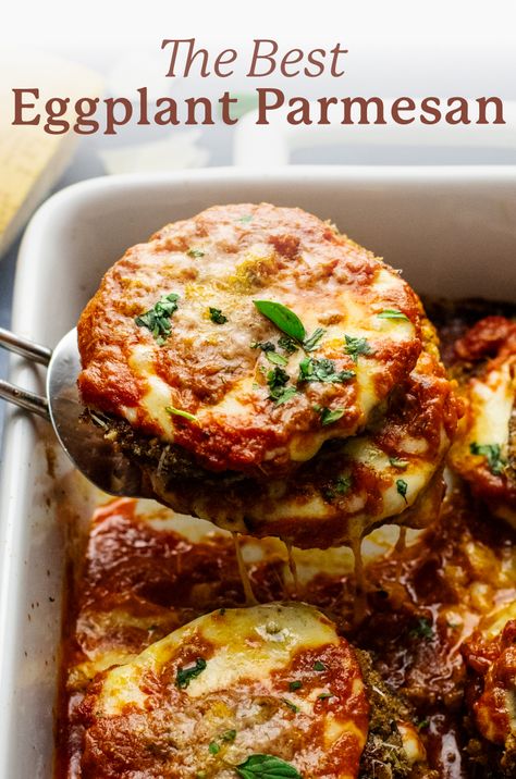 an image of a spatula lifting eggplant parmesan out of a white baking dish with the words "the best eggplant parmesan" above the image. Eggplant Parmeggiano, Eggplant Parm Sliders, Eggplant Parm Stacks, Eggplant Parmesan Roll Ups, Freezer Eggplant Parmesan, Fried Eggplant Parmesan, Eggplant Parmesan Recipes, Best Eggplant Parmesan, Italian Eggplant Recipes