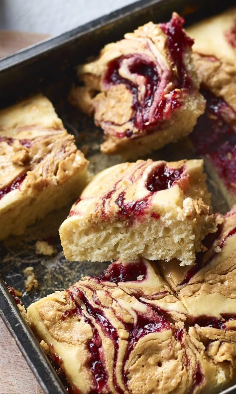 Nadiya's peanut butter and jelly traybake is so quick, it's like making one big pancake. Now, is it a breakfast or a pudding? Nadiya Hussain Pancake Tray Bake, Traybake Recipes Cake, Breakfast Traybake, Pancake Tray, Nadiya Hussain Recipes, Peanut Butter Squares, Nadiya Hussain, Cake Squares, Quick Baking