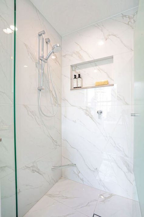 Groutless Tile Shower Ideas, Porcelain Marble Shower Walls, White Porcelain Tile Shower Walls, Large Marble Shower Tile, Wood Tiles Bathroom Floor, Carrera Tile Bathroom Shower Walls, Big Marble Tile Bathroom, Bathroom Decor Minimal, Minimal Grout Shower Tile