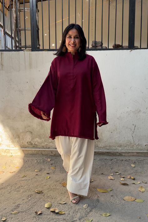 The Dhaaga Set in Dark Maroon is the ultimate winter wear for those seeking comfort with a touch of elegance. Crafted from soft winter spun fabric, this kurta set features a cozy, oversized Pakistani-inspired fit, perfect for chilly days. The ensemble includes our signature Farsi salwar in an equally oversized design, ensuring a relaxed yet stylish look.

Ideal for work, casual outings, or family gatherings, this set offers warmth without compromising on style. Easy to care for, it’s recommended to hand wash or dry clean to maintain its luxurious feel and finish. Embrace winter in effortless sophistication with the Dhaaga Set! Farsi Salwar, Pakistani Suit, Suit Collection, Dark Maroon, Soft Winter, Patiala Salwar, Punjabi Salwar Suits, Pakistani Suits, Winter Outfits For Work