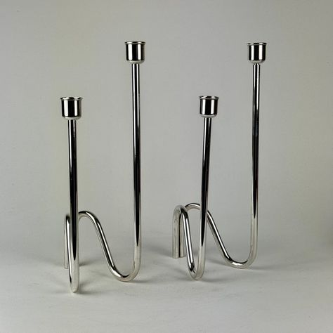 Set of 2 silver-plated candle holders model "Fiamma" ("Flame" in Italian) by Lino Sabattini for Sabattini Argenteria. They were designed in 1970s and are fairly rare to come across. Each candle holder has two holders each. Each is signed at the base.  Circa: 1970s Made in: Italy Designer: Lino Sabattini Condition: Overall very good. One pole of one candle-holder does have a few scratches as seen in the photo Dimensions: 4" W x 4 1/2" D x 12 1/2" H Mid Century Candle Holders, Silver Candle Holders, Modern Candle Holders, Silver Candle, Modern Nails, Photo Dimensions, One Candle, Kids Corner, Holder Design