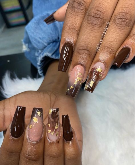 Brown and nude acrylic nails with gold foil flakes. Trendy Fall Nails Gold Foil, Brown Gold Flake Nails, Brown And Gold Foil Nails, Nail Design With Gold Flakes, Brown Nails With Gold Foil, Brown Nails With Gold Flakes, Brown And Gold Nails Short, Nails With Gold Foil Flakes, Brown And Nude Acrylic Nails