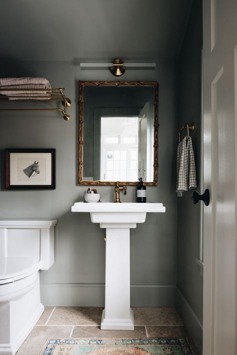 Powder bathroom design idea with dark green wall color, limestone tile flooring, white pedestal sink, brass fixtures and gilded brass mirror. Jean Stoffer Design, Jean Stoffer, Small Downstairs Toilet, Downstairs Toilet, Powder Room Design, Power Room, Pedestal Sink, Downstairs Bathroom, Room Walls