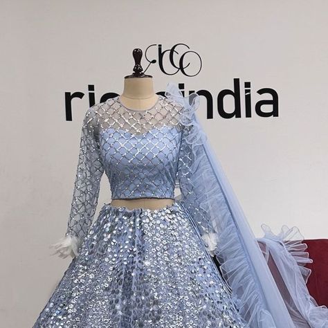 Ricco India on Instagram: "Bridesmaid Fits 🥰
A beautiful pastel blue Lehenga with sparkling silver embroidery, feather sleeves and a grilled dupatta!
#custommade #bluelehenga #icebluelehenga #bridesmaidlehenga #sparklinglehenga #riccoindia" Pastel Blue Lehenga, Embroidery Feather, Feather Sleeves, Pakistani Brides, Bridesmaid Lehenga, Lehenga Design, Silver Embroidery, Blue Lehenga, Lehenga Designs