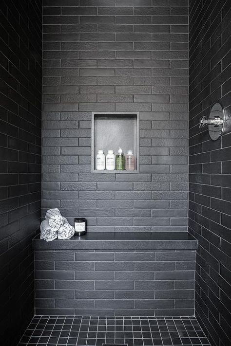 A black tiled shower bench fitted with a black quartz top sits on black gird floor tiles and against black brick wall tiles finished with a black niche. Matte Bathroom Tiles, Black Matte Bathroom, Matte Bathroom, Black Subway Tiles, California Beach House, Black Brick Wall, White Oak Hardwood Floors, Black Brick, Transitional Bathroom