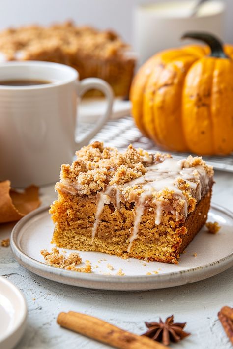 Easy Pumpkin Coffee Cake: A moist, spiced pumpkin cake topped with a crumbly streusel, perfect for cozy mornings and fall gatherings. Pumpkin Coffee Cake With Streusel, Easy Pumpkin Coffee Cake, Pumpkin Crumble Cake, Pumpkin Streusel Coffee Cake, Pumpkin Coffee Cake Recipes, Pumpkin Crumble, Pumpkin Coffee Cake, Sweet Potato Dessert, Banana Coffee Cakes