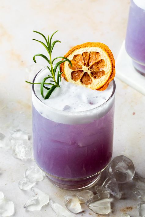 This unique gin gets it's purple-blue hue from the butterfly pea flowers used in its distillation process and it makes for some gorgeous cocktails. This simple Empress gin cocktail is a vibrant take on a gin sour infused with rosemary simple syrup and dry shaken for a creamy foam finish. Empress Gin Cocktail, Gin Sour Recipe, Empress Gin, Homemade Beef Stew Recipes, Girls Night Drinks, Summer Mocktails, Butterfly Pea Flowers, Cocktail Gin, Purple Cocktails