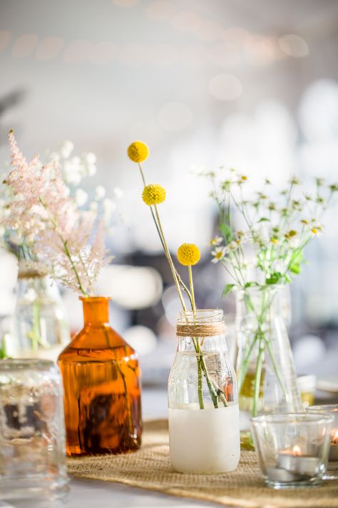 DIY Glass Milk Bottle Centerpieces Milk Bottle Centerpiece, Milk Bottle Diy, Western Centerpieces, Diy Farm Wedding, Wildflower Centerpieces, Centerpiece Flower, Bottle Centerpieces, Indoor Wedding Ceremonies, Glass Milk Bottles