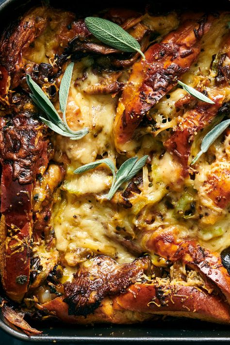 Mushroom Bread Pudding Recipe - NYT Cooking Thanksgiving Recipes Potluck, Herby Bread, Thanksgiving Bonfire, Butter Stuffing, Mushroom Bread Pudding, Mushroom Bread, Winter Side Dishes, Tomato Confit, Thanksgiving Potluck