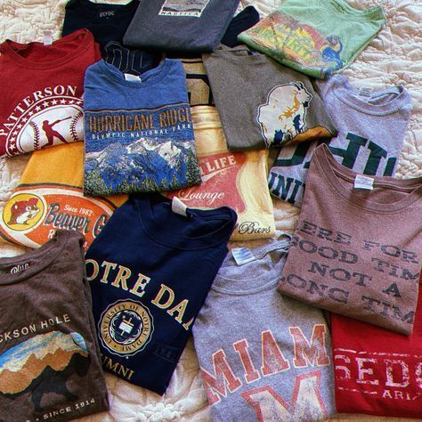 Channel retro vibes with our vintage tees. Explore our collection and find the perfect blend of style and nostalgia. #VintageStyle #TeeGoals 90s Shirts Graphic Tees, Vintage 90s Style, College Names, Style Graphic Tee, Clothing Boxes, 90s Shirts, Wholesale Shirts, Graphic Tees Vintage, Graphic Tee Shirt