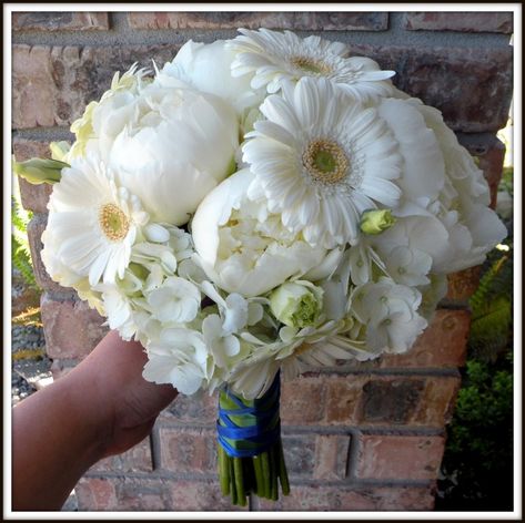 A beautiful flower arrangement of peonies, gerbera daisies, and hydrangeas. But with blue hydrangeas and yellow daisies Gerber Daisy Bouquet Wedding, Gerbera Daisy Wedding, Gerbera Daisy Bouquet, Blue Wedding Bouquet, Daisy Bouquet, Hydrangea Bouquet, Gerber Daisies, Peonies Bouquet, Wedding 2024