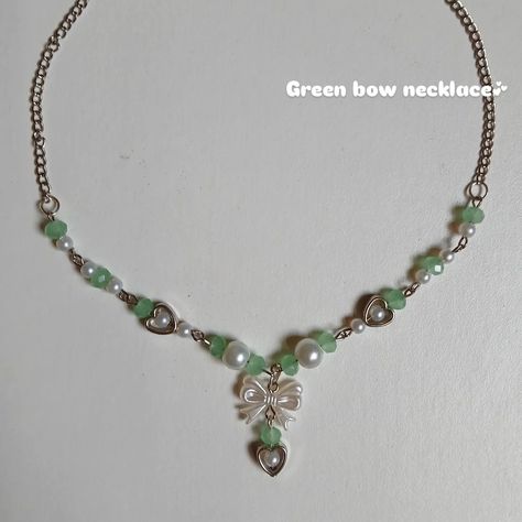 Green Bow Necklace🎀✨️ Color Options: pearl white, green, pink, lavender. Price: 200₹ + shipping. Customization available🥀✨️ #phonecharm #handmade #handmadejewelry #smallbusiness #connection #communitylove #favaudience #instaengagement #jewelsknot #aesthetic #ａｅｓｔｈｅｔｉｃ #inpiration Green Beaded Necklace, Bow Necklace, Green Bows, Pink Lavender, Green Necklace, Aesthetic Aesthetic, Phone Charm, Crafts To Do, White Green