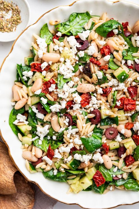 This healthy mediterranean orzo salad is loaded with sun-dried tomatoes, cucumber, olives and feta cheese. It's fresh, easy and the perfect make-ahead recipe for a light meal or summer potluck. Mediterranean Orzo Salad, Mediterranean Orzo, Summer Potluck, How To Cook Orzo, Orzo Salad, Orzo Pasta, Sun Dried Tomatoes, Cannellini Beans, Kalamata Olives