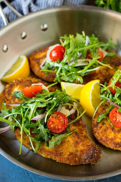 Chicken Milanese is crispy chicken cutlets topped with a fresh arugula and tomato salad, an easy yet elegant dinner! #chicken #dinner #dinneratthezoo Cutlet Recipes, Milanese Recipe, Chicken Cutlet Recipes, Easy Dinner Options, Chicken Milanese, Chicken Cutlet, Cutlets Recipes, Dinner Options, Chicken Cutlets