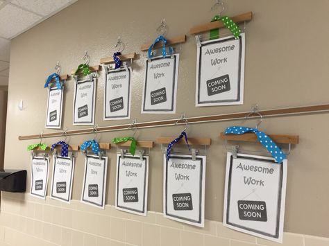 My new method for displaying work in our hallway!! Children's pant hangers on command hooks. A bit of an investment, but students will have a portfolio of their work at the end of the year. PLUS admin and parents can see progress at a glance! Prek Student Work Display, Display Students Work In Hallway, Classroom Hallway Display Student Work, Hallway Student Work Display, Hallway Display Student Work, Hallway Work Display, Hanging Student Work, School Hallway Displays, 2023 Classroom