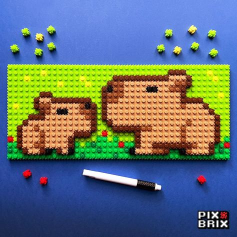 Behold, our capybara creation 🐾 - crafted pixel by pixel with the magic of Pix Brix! Fun fact alert: Capybaras, the chill giants of the rodent world, are known for their laid-back attitude and strong social bonds, often seen hanging out in groups along rivers and swamps in South America. 🌿👫 Feeling inspired? Why not build your own pixel version of this friendly giant? With Pix Brix, you can transform simple pixels into extraordinary creations. No glue, no mess, just endless possibilities. S... Pixel Art Big Pixels, Pixel Capybara, Capybara Pixel Art, Kangaroo Pixel Art, Pixel Art Grid Capybara, Perler Bead Corgi, Pix Art, Perler Crafts, Feeling Inspired