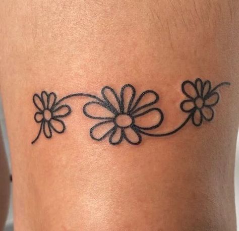 130+ Daisy Tattoo Ideas To Put A Smile On Your Face Daisy Anklet Tattoo, Fine Line Daisy Chain Tattoo, Simple Flower Tattoo Ideas, Daisy Finger Tattoo, Toe Ring Tattoos, Daisy Tattoo Ideas, Daisy Chain Tattoo, Small Daisy Tattoo, Daisy Tattoos