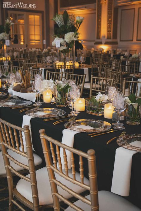 Gold Chivari Chairs Black Table Cloth, Black Silver Gold Table Setting, Black Wedding With Gold Accents, Black And Gold Wedding Place Settings, Black And Gold Place Setting Wedding, Black Gold And Glass Wedding, Gold White Wedding Table Setting, Black Wedding Table Linens, Black And Cream Table Setting